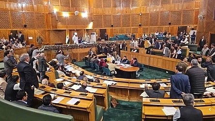 Members of the Jammu & Kashmir Legislative Assembly in session, with visible tension following a controversial remark by a BJP MLA from Kishtwar.