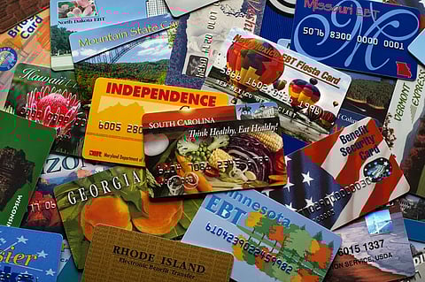 A pile of electronic benefit transfer (EBT) cards used to redeam benefits from the welfare department.