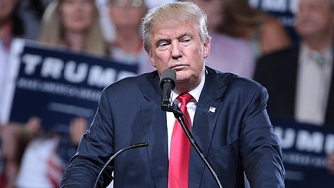 Donald Trump is adressing people at a campaign