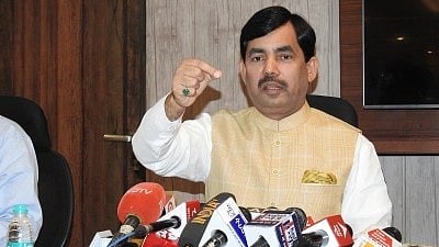 In the image BJP leader Shahnawaz Hussain is adressing the press in a press conference