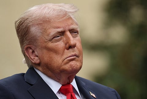 Close up image of Donald Trump wearing his classic blue suit and red tie