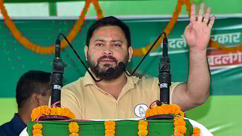 In the image Tejashwi Yadav is shown addressing the people while campaigning for upcoming Bihar election