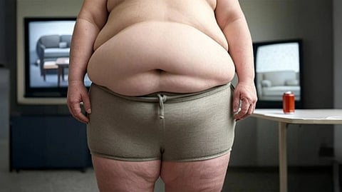 In the image a man is shown with a big stomach showcasing obesity