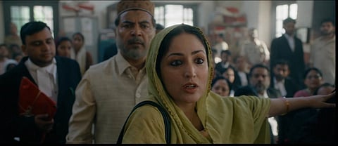 In the image Shah Bano played by Yami Gautam is shown in the court with the lawyers and other courtroom people