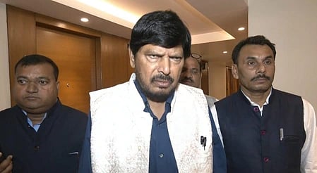 In the image Ramdas Athawale is shown wearing a traditional formal dress