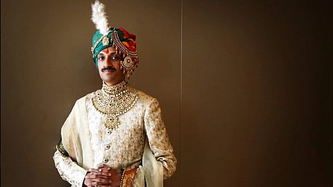 A portrait of India’s first openly gay prince, Manvendra Singh Gohil, dressed in traditional royal attire with a turban and ornate jewellery.