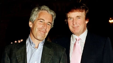 Jeffery epstein wearing black coat and blue shirt with Donald Trump in night clicking a photo both are smiling at the camera