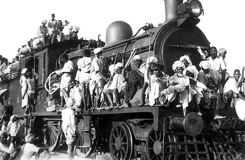 In the image many people are shown in a trail sitting outside