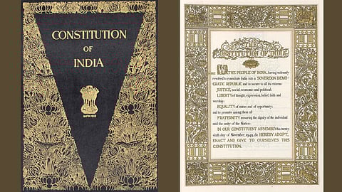 Cover of the Indian Constitution in black with gold ornate designs and the Ashoka emblem. Adjacent page features its preamble in an ornate frame.
