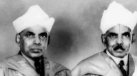 Mudaliar Brothers in a formal attire and turbans, circa early to mid-1900s, face the camera with serious expressions. The black-and-white photo conveys a solemn tone.