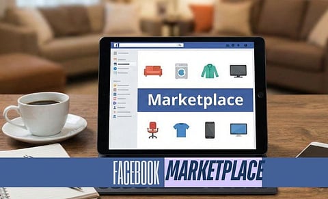 Image of Tablet displaying Facebook Marketplace with icons of furniture, clothing, and electronics. Nearby are a coffee cup, notebook, and pen on a wooden table. Cozy home setting.