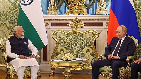 PM Modi in a bilateral meeting with the President of the Russian Federation, Mr. Vladimir Putin, in Moscow, Russia on July 09, 2024. They are sitting in a well decorated room looking at each other in a formal attire