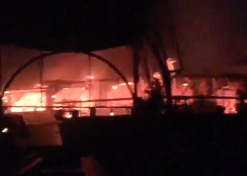 Blurry pixelated image of the Birch by Romeo Lane fire in North Goa. in the image a huge blaze of fire can be seen in the night.