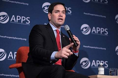 Image of Marco Rubio speaking at an event in Manchester, New Hampshire. He is holding a mic in his left hand.