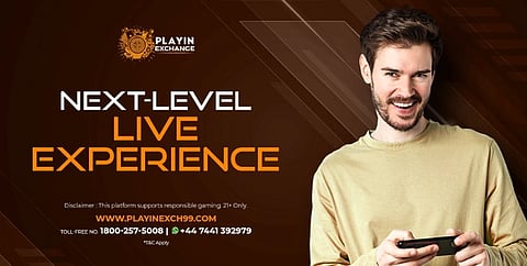 Smiling man holding a phone on a dark brown, geometric background. Bold text reads "Next-Level Live Experience" with gaming contact details below.
