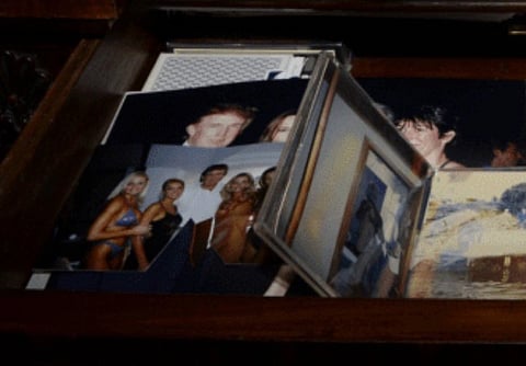 A drawer filled with scattered photographs, including images of people at events and beach scenes, creating a sense of nostalgia and memories. And behind the images there is one image with trumps face visible