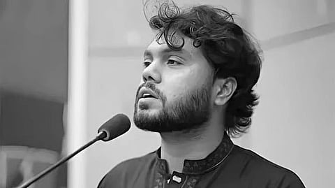 In the image Osman Hadi is adressing people