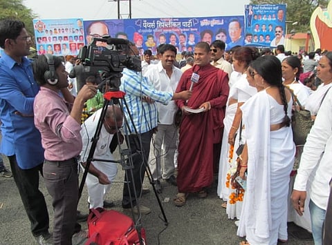 Indian people visit Dr. Babasaheb Ambedkar Marathwada University to celebrate the Namvistar Din. nterviewer interacting with public and Camera operator is operating camera during Namvistar Din Celebration.