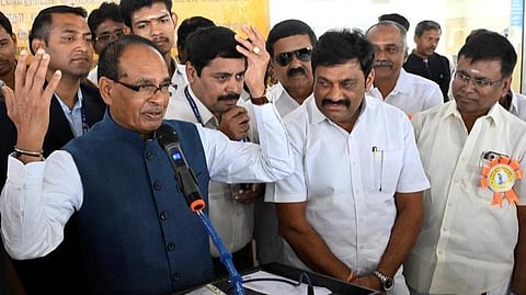 Shivraj Singh Chouhan at a public rally, addressing people, surrounded by his supporters and party workers