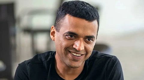 Zomato co-founder Deepinder Goyal in a black shirt, seated in a well-lit room. He exudes a friendly and approachable demeanor