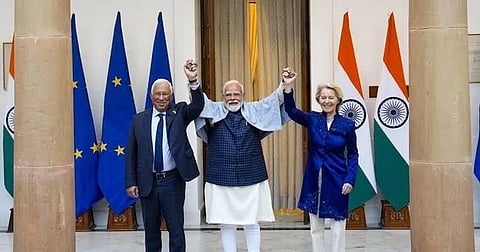 In the image PM Modis is shown eraising hands of European Commission President Ursula von der Leyen and European Council President António Costa