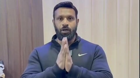 Deepak Kumar stands with folded hands in screenshot from a social media video
