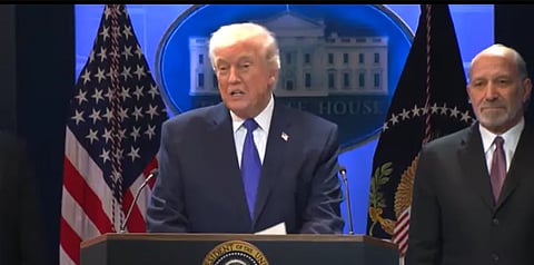 President of the Unites States Donald Trump standing behind the podium addressing a press conference