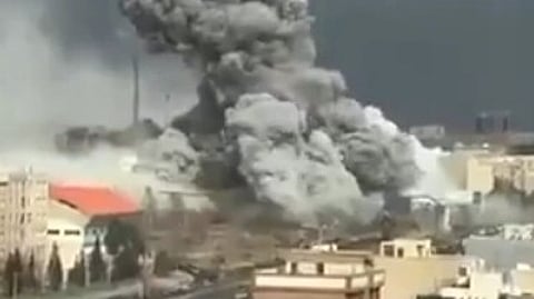 Image of black smoke coming out of destroyed buildings in Iran