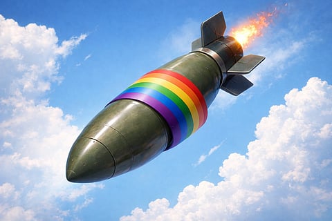 A large green missile with a rainbow flag wraps around its center, flying against a bright blue sky and white clouds, symbolizing contrast or irony.