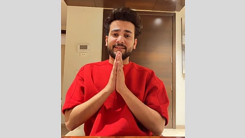 Elvish Yadav addressing the camera, hands folded, sigh of relief