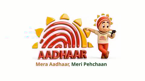 Aadhaar logo and mascot, with text reading "mera aadhaar, meri pehchaan"
