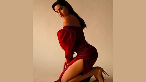 Nora Fatehi wearing a red dress