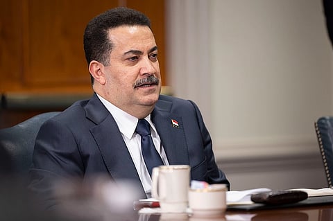 Iraqi Prime Minister Mohammed Shia’ al-Sudani wearing suit in an office