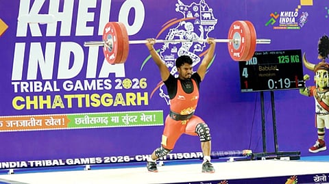 Forged in hardship, Jharkhand’s Babulal Hembrom lifts his way to glory in Khelo India Tribal Games in Raipur, Chhattisgarh. Photo credit: KITG 2026