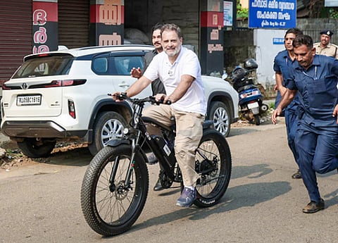 Kottayam: Leader of Opposition in Lok Sabha and Congress MP Rahul Gandhi leaves on a bicycle after attending a public gathering for the Kerala Assembly elections at Pampady Bus Stand in Puthuppally, Kottayam on Monday, March 30, 2026. (Photo: IANS/AICC)