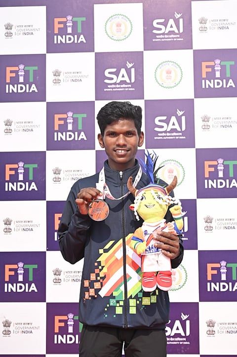 How a self-taught Suraj Mashi bagged men’s 5000m silver with borrowed spikes at the Khelo India Tribal Games (KITG) in Jagdalpur, Chhattisgarh, on Tuesday. Photo credit: KITG 2026