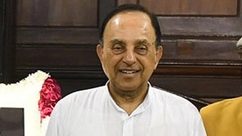 In the image Subramanian swamy is shown smiling at the camera he is wearing a white kurta