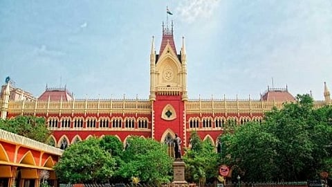 The building of Calcutta High court is shown with greenery