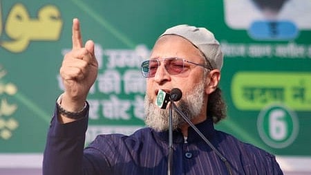 In the image Asaduddin Owaisi is shown adressing the people
