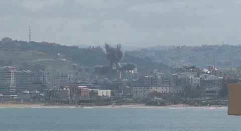 Smoke rises in a region after Israeli airstrikes as conflict escalates following ceasefire breakdown