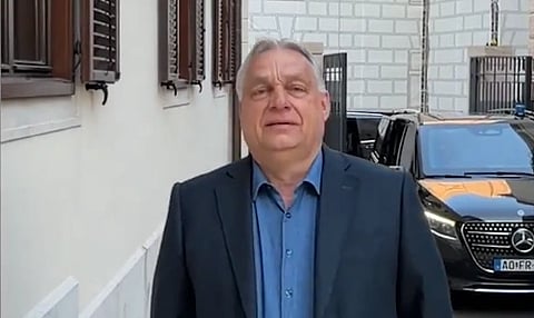 PM Viktor Orban standing in a open street