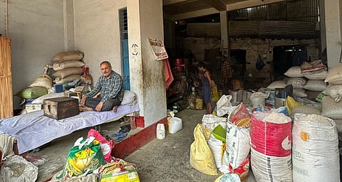 Grain kept in a local trader's godown, where labourers sell their grain