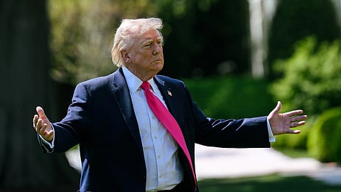 Donald Trump in a suit with his arms open