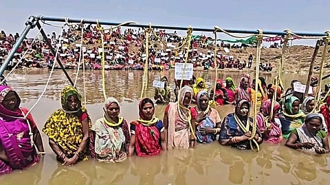 Villagers protest on the banks of the Ken River against displacement caused by the Ken-Betwa River Project