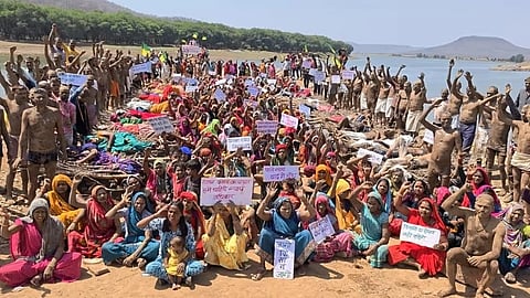 Villagers protest on the banks of the Ken River against displacement caused by the Ken-Betwa River Project