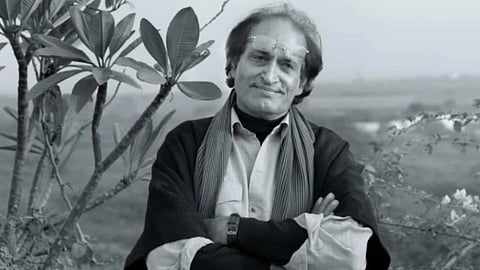 Raghu Rai smiling with folded hands, outdoor setting
