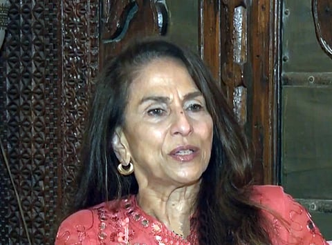 In the image Shobhaa De is shown in a house like surrounding