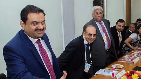 Gautam Adani, with Mukesh Ambani in the background