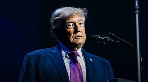 In the image Donald Trump is shown addressing people
