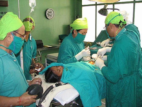Doctors performing an appendectomy in Assam